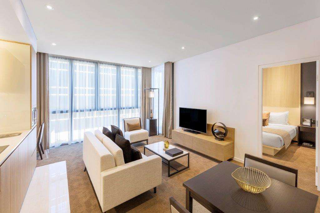 Skye Suites Sydney Szoba fotó A living room at the hotel